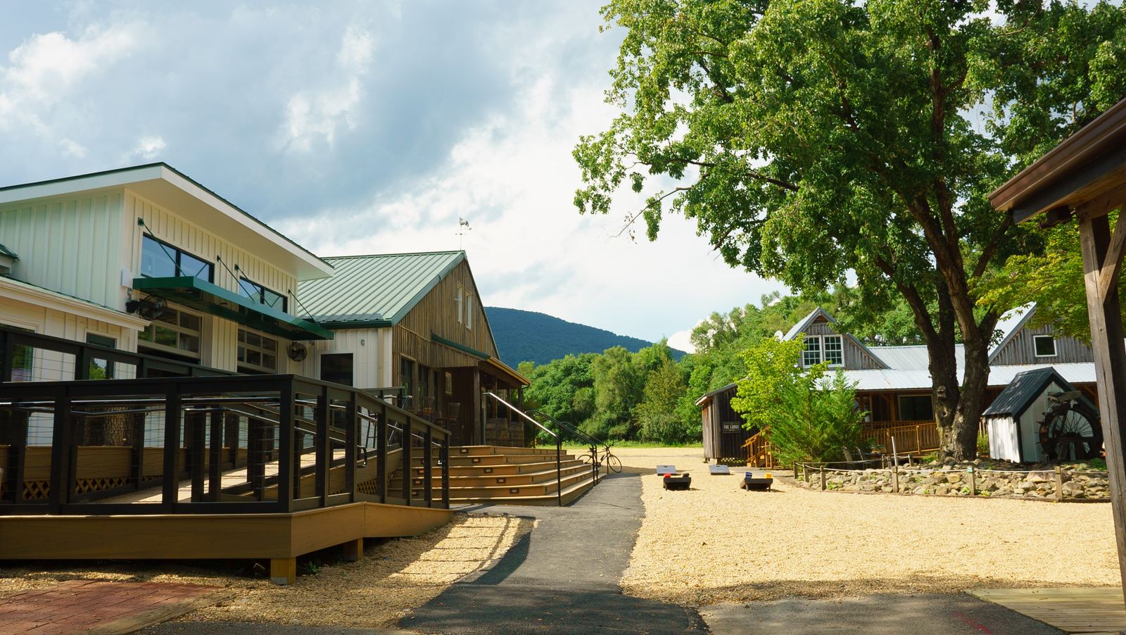 The Nelson County building's long wooden deck, trees behind
